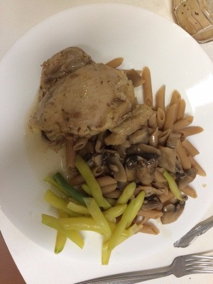 Chicken Marsala on plate with pasta and beans