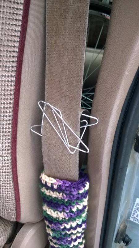 Two giant paper clips to keep seat belts together.