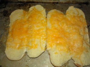 melted cheese on hotdog buns