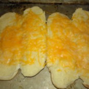 melted cheese on hotdog buns