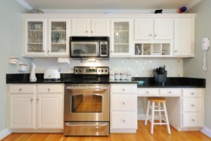 A microwave oven over a stove.