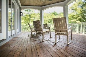 An open porch on the outside of a house.