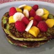 Avocado pancakes with fruit on plate