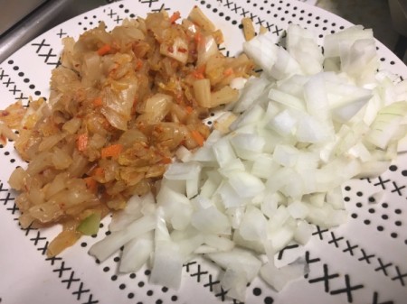 Kimchi and chopped onions on plate