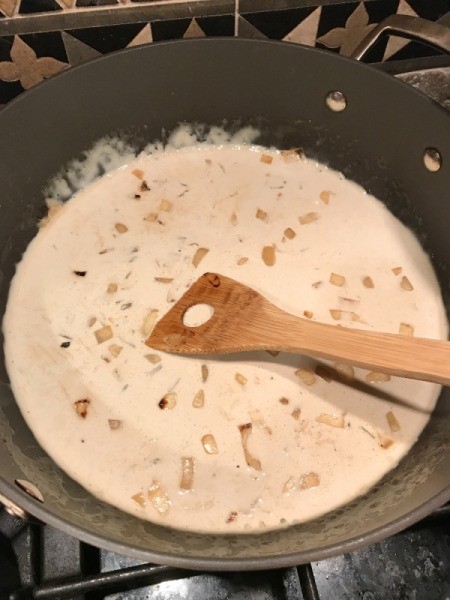 coconut milk added to onions