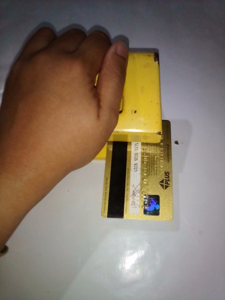 Expired Credit Cards for Storing Earphones - punch holes in the card