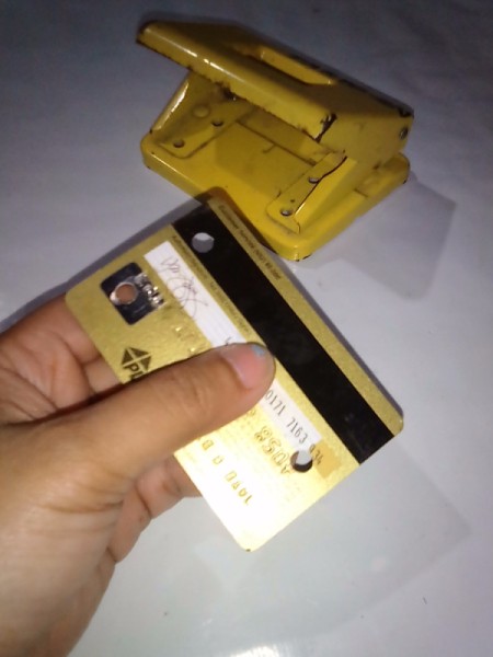 Expired Credit Cards for Storing Earphones - one on the bottom and two on top