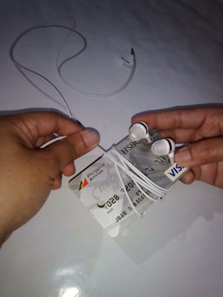 Expired Credit Cards for Storing Earphones - wrap wire around the narrow width of the card