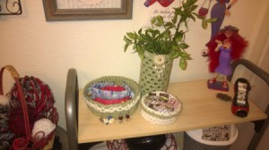 Crochet Accents for a Bathroom with New Colors - jewelry bowls and foliage in cylinder