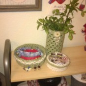 Crochet Accents for a Bathroom with New Colors - jewelry bowls and foliage in cylinder
