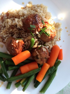 Teriyaki Meatballs on plate with rice and vegetables