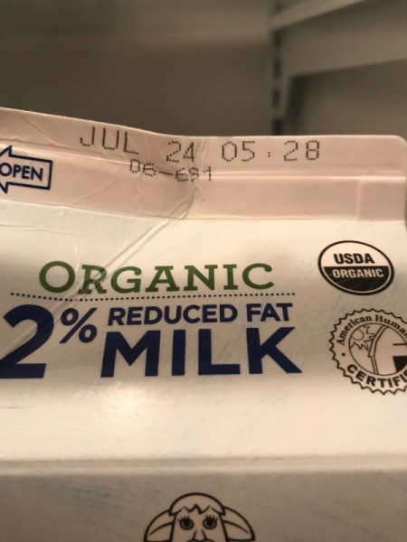 A carton of milk with a July 24th expiration date.