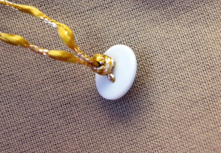 Button and Bead Knotted Bracelet - tie the cord in a knot behind the button