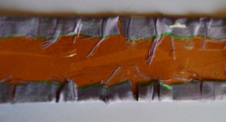 Easy Floral Lace Serviette Rings - cut slits into the satin extending over the edge of the cardstock, fold over the back and tape in place