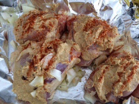 spreading paprika on Chicken