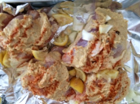 adding lemon slices to Chicken