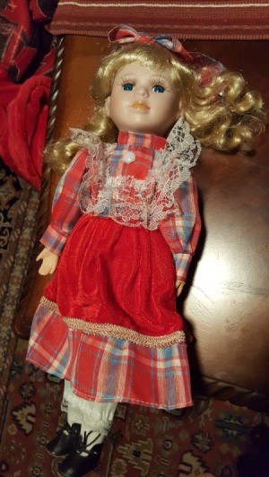 Identifying a Porcelain Doll - blond haired doll wearing a long plaid dress