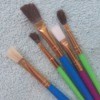 A collection of paint brushes of different sizes.