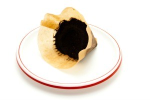 A coffee filter with used coffee grounds.