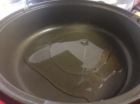 adding oil and water to pan