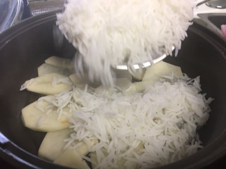 adding rice to potato slices