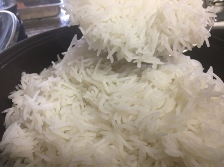 adding rice to potato slices