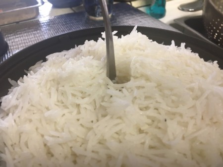 making holes in rice in pan