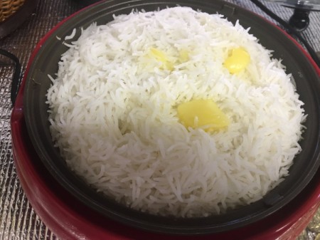 adding butter to rice