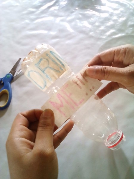 Plastic Bottle for Rehydrating Indoor Plants - write message on masking tape and stick to bottle