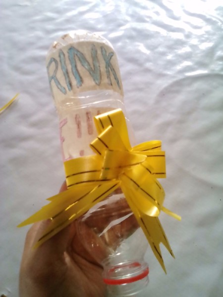 Plastic Bottle for Rehydrating Indoor Plants - tape on bow