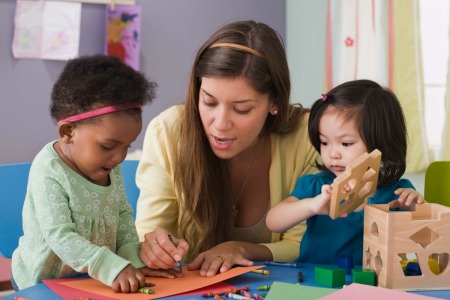 A childcare provider working with children.