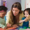 A childcare provider working with children.
