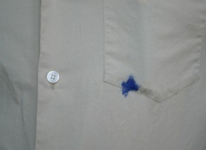 Blue ink stain on a white dress shirt.