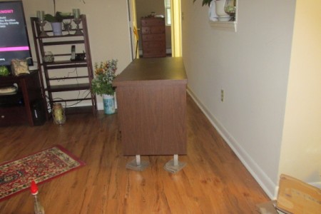 A piece of heavy furniture with washcloths under each leg, to assist in moving.