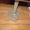 A washcloth under the leg of a heavy piece of furniture, to assist in moving it.