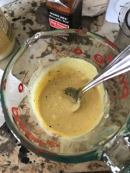 mixing sauce for coleslaw