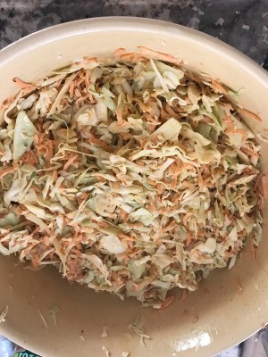 mixing sauce in Sweet and Spicy Coleslaw