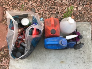 A collection of used motor oil and filters.