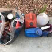 A collection of used motor oil and filters.