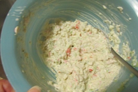 mixing crab meat, condiments and spices