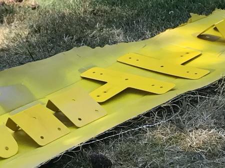 Refinishing a Wooden Playground - yellow brackets