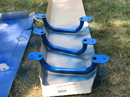 Refinishing a Wooden Playground - painting the underside of the handles