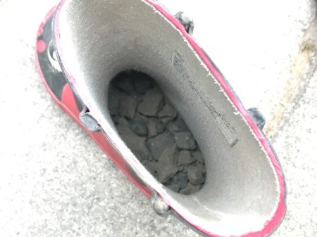 Rubber Boot Planter - boot with a layer of gravel