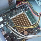 How to Change Your Motherboard and Build a Computer - insert motherboard into plate and make sure it is properly aligned