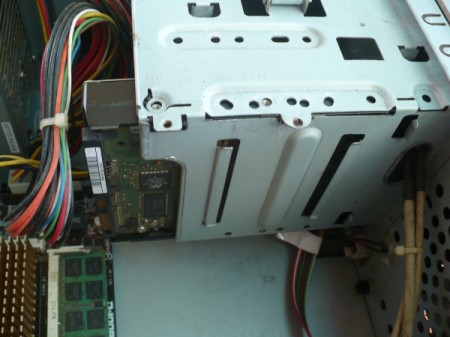 How to Change Your Motherboard and Build a Computer - insert hard drive into the tray