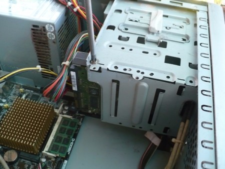 How to Change Your Motherboard and Build a Computer - screw hard drive in place