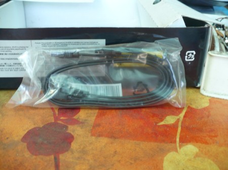 How to Change Your Motherboard and Build a Computer - open package of SATA cables and attach to hard drive and DVD drive