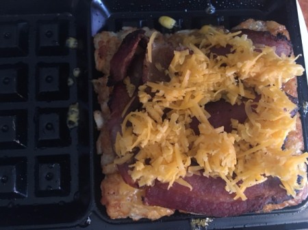 cheese on bacon on Tater Tot Waffle