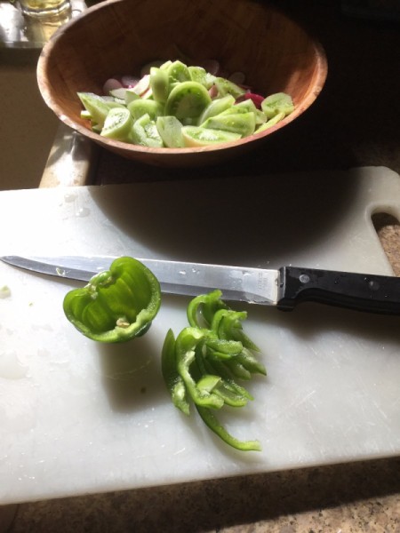 slicing green peppers