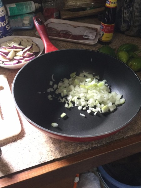 sliced onion in wok
